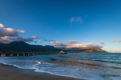 Scenic view sunrise early morning at waioli beach park, hanalei bay, kauai, hawaii, usa against sky