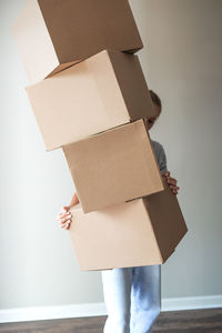 Midsection of woman holding cardboard box