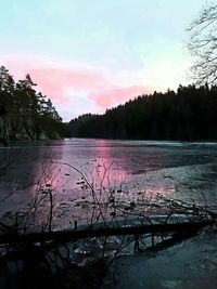 Scenic view of lake against dramatic sky