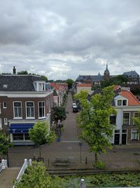 Buildings against cloudy sky