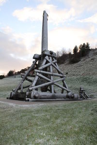 Built structure on field against sky