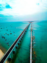 High angle view of swimming pool by sea against sky