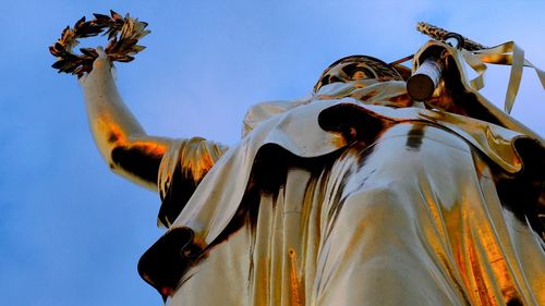Low angle view of statue against clear sky, 'victory'
