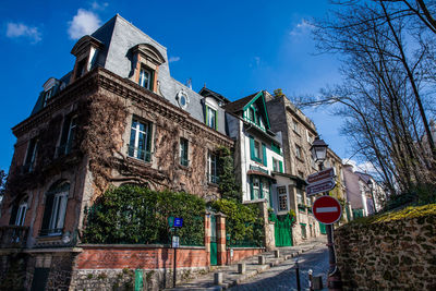 Low angle view of building against blue sky