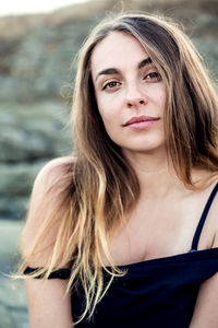 Close-up portrait of smiling woman outdoors