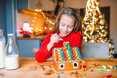 Girl looking at camera on table