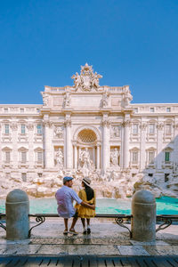 Statue of historic building against blue sky