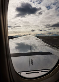 Aerial view of sea seen through airplane window