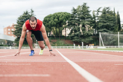 Portrait of man on running track