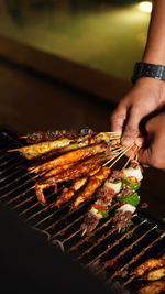 Cropped hand of man holding food