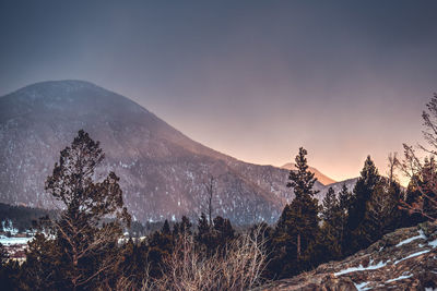 View of snowcapped mountain against dramatic sky