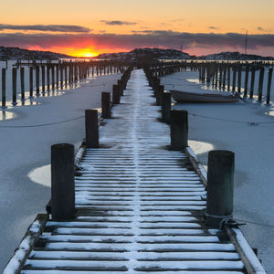 Pier in snow, skintebo, gothenburg, sweden