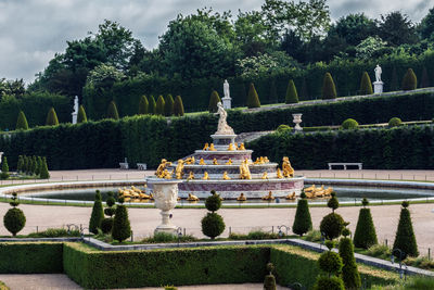 Statue against trees