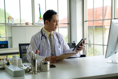Young businesswoman working at office