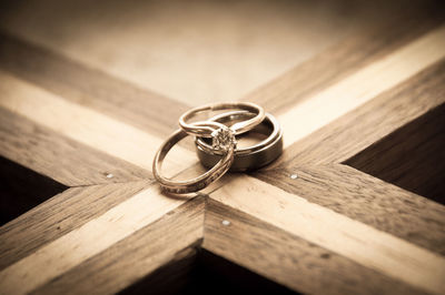 Close-up of wedding rings on table
