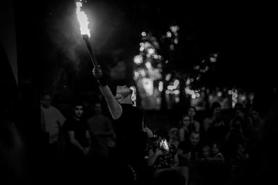 People enjoying music concert at night