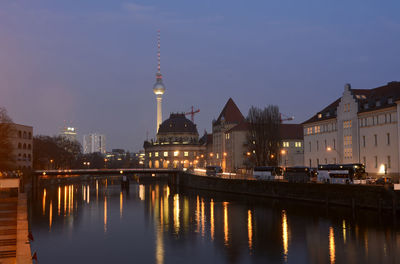 Reflection of illuminated buildings in water