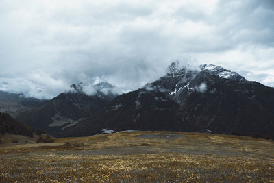 Scenic view of snowcapped mountains against sky