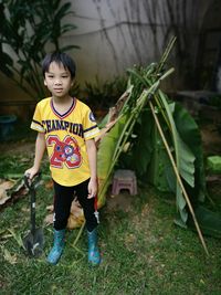 High angle view of boy standing on field