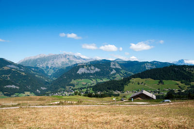 Scenic view of landscape and mountains against sky