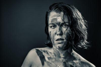 Close-up portrait of a serious young woman