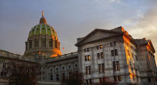 Exterior of pennsylvania state capitol against sky during sunset