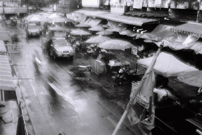 High angle view of people on street in rain