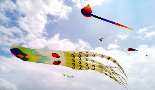 Low angle view of kite flying in sky