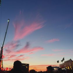 Silhouette city against sky during sunset