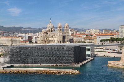 Mucem museum by sea against sky in city