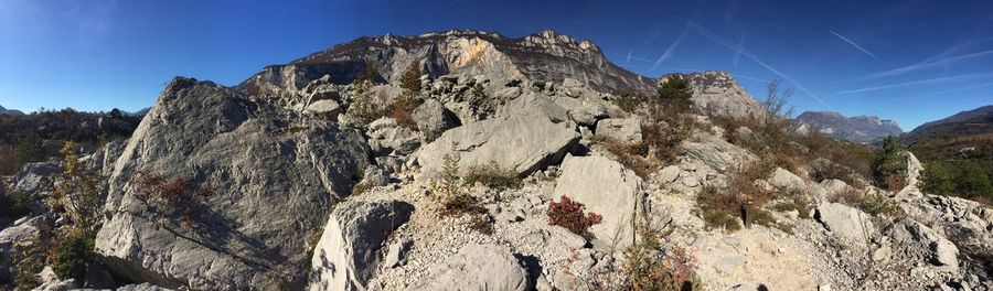 Low angle view of rock formation against sky