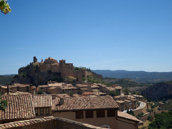 Townscape against clear blue sky