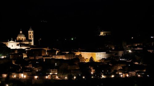 High angle view of illuminated buildings in city at night