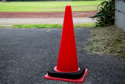 Close-up of red arrow symbol on road