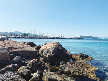 Scenic view of sea against clear blue sky