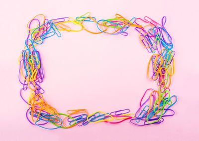 Close-up of multi colored wire against white background
