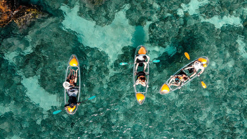 High angle view of people swimming in sea