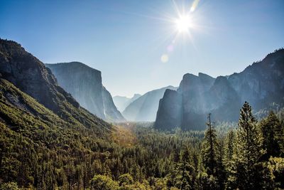 Scenic view of mountains against bright sun in yosemite national park