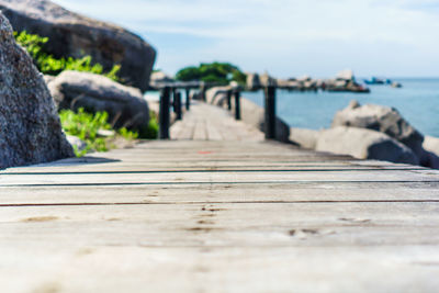 Surface level of wooden boardwalk by sea