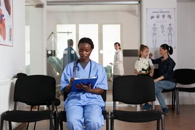 Group of people sitting on chair