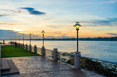 Pier on sea during sunset