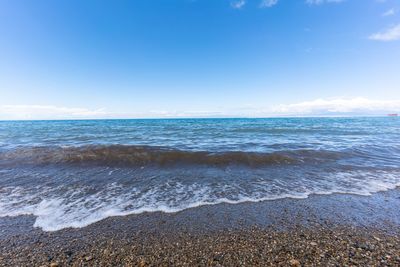 Scenic view of sea against blue sky