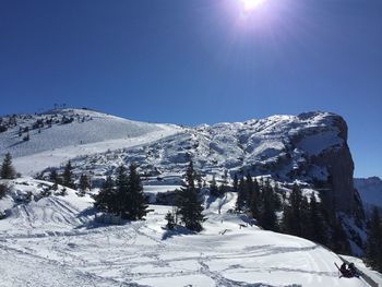 Snowcapped mountains against clear blue sky