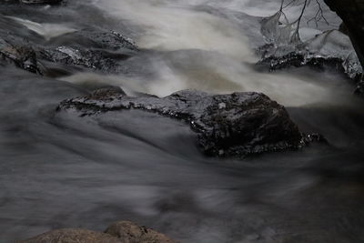 Scenic view of water flowing through rocks