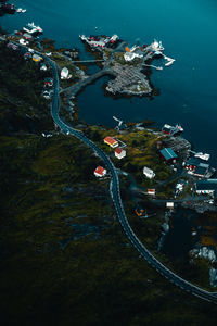 High angle scenic view of a coastal road winding by the iconic reine bay.