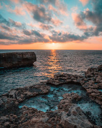 Scenic view of sea against sky during sunset