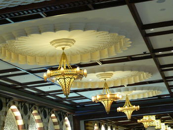 Low angle view of chandelier hanging in temple