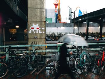 Bicycles parked on road in city at night