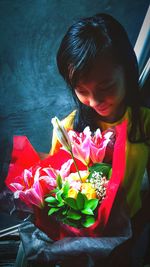 Close-up of girl with pink flowers