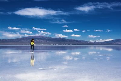Rear view of woman standing on salt flat in salta, argentina